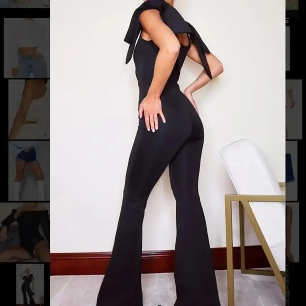 NEW PrettyLittleThing Black Bow Shoulder Flared Leg Scuba Jumpsuit size 12